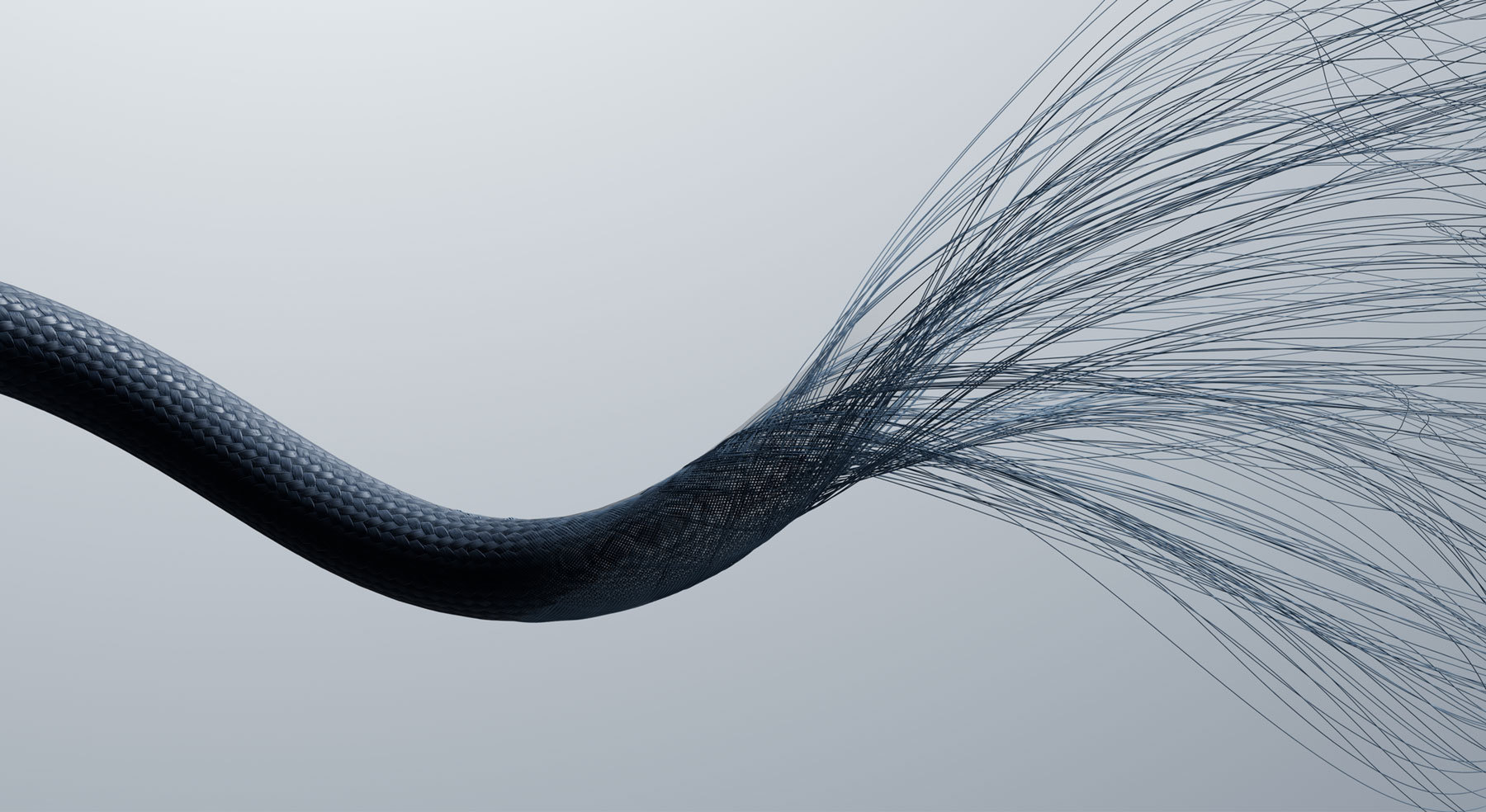 编织纤维交织成一条 Beats 连接线，展示其耐用性和编织纹理。